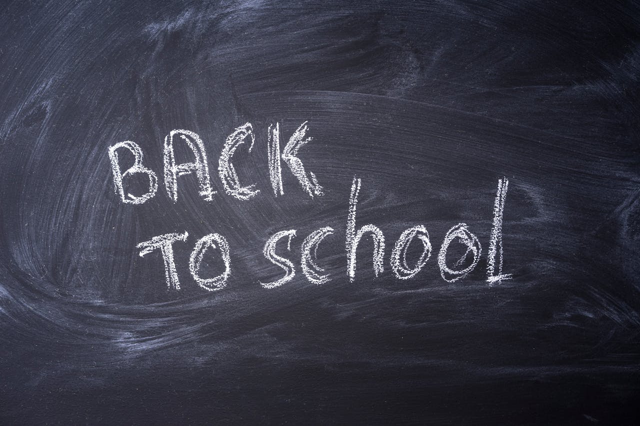 Blackboard with Back to School written in chalk, ideal for educational themes.